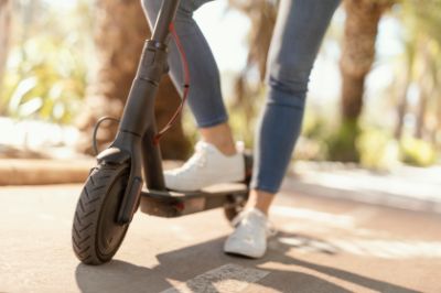 young-woman-rides-electrical-scooter-city
