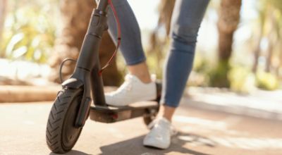 young-woman-rides-electrical-scooter-city